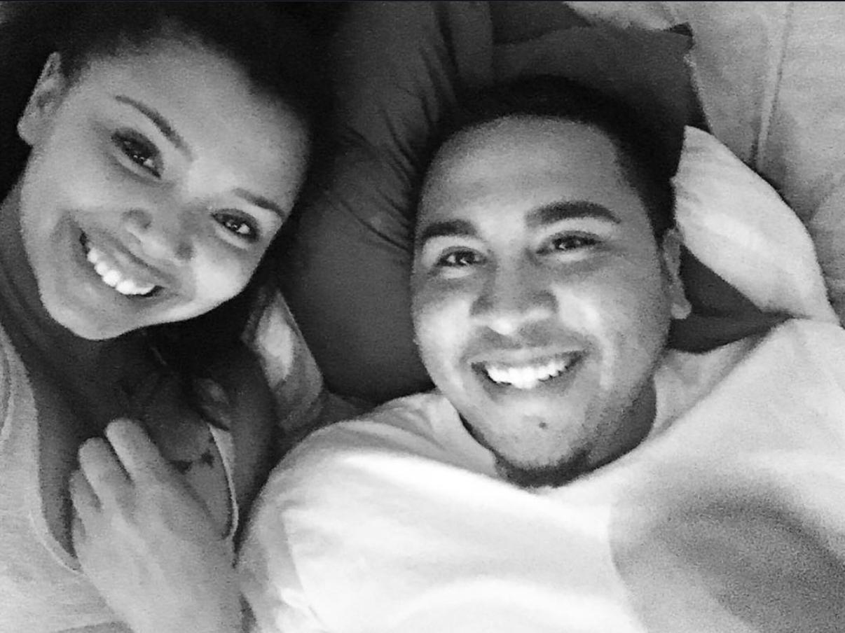 Arielle and Kevin smiling together in black and white